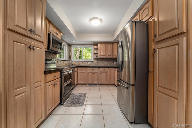 4729 Curtis Ln, Clarkston, MI 48346 - kitchen with appliances with stainless steel finishes, open shelves, light tile patterned floors, decorative backsplash, and a tray ceiling