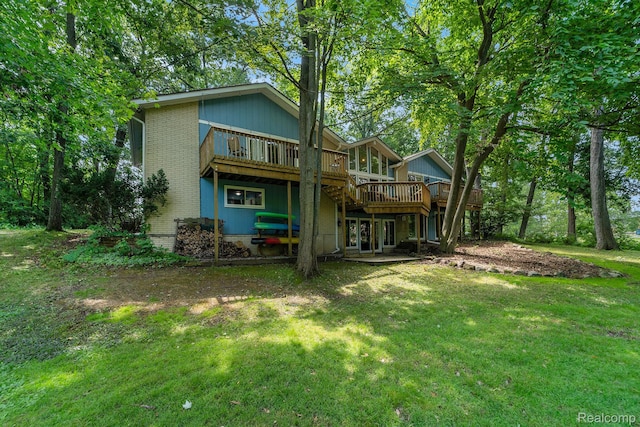 4729 Curtis Ln, Clarkston, MI 48346 - rear view of house with a wooden deck and a lawn