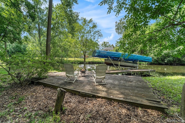 4729 Curtis Ln, Clarkston, MI 48346 - view of yard featuring an outdoor fire pit and a deck with water view