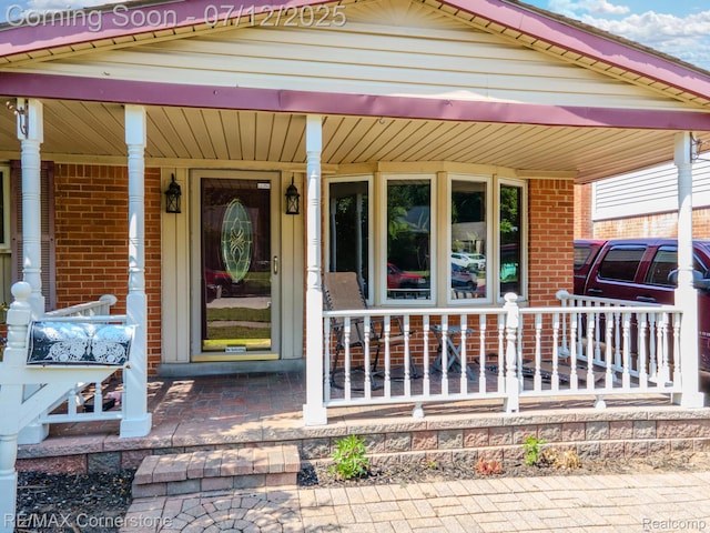 34060 Avondale St, Westland, MI 48186 - entrance to property with a porch and brick siding