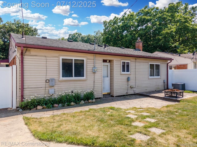 34060 Avondale St, Westland, MI 48186 - rear view of house with a patio and a chimney