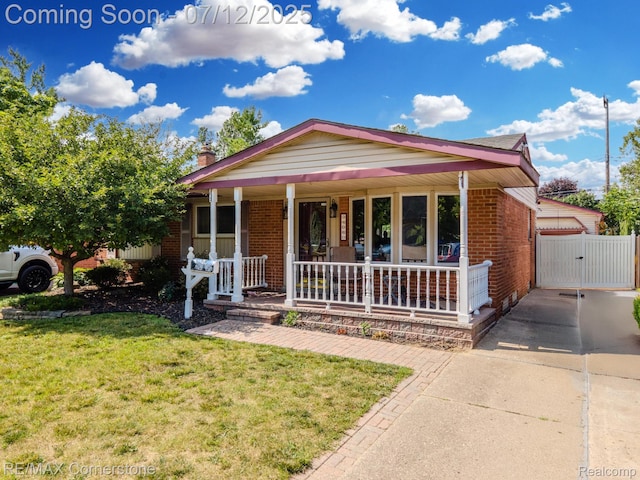 34060 Avondale St, Westland, MI 48186 - ranch-style house featuring covered porch, brick siding, a front lawn, a gate, and a chimney