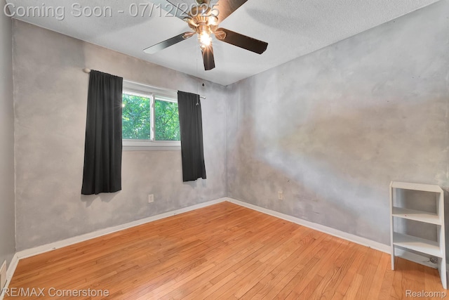 34060 Avondale St, Westland, MI 48186 - unfurnished room featuring wood-type flooring, ceiling fan, and a textured ceiling