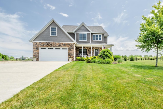 4785 Lauren Ln, Saint Joseph, MI 49085 - craftsman-style house featuring concrete driveway, a front lawn, an attached garage, a porch, and stone siding