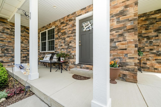 4785 Lauren Ln, Saint Joseph, MI 49085 - entrance to property featuring covered porch and stone siding