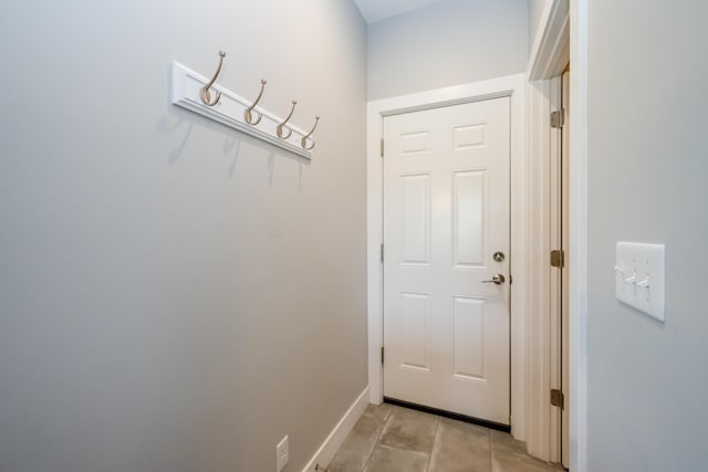 4785 Lauren Ln, Saint Joseph, MI 49085 - doorway to outside with light tile patterned floors and baseboards