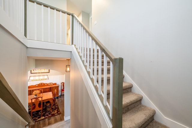 4785 Lauren Ln, Saint Joseph, MI 49085 - stairway with arched walkways and a chandelier