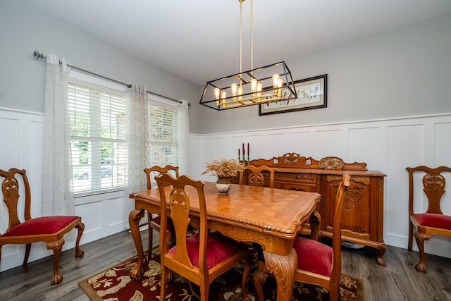4785 Lauren Ln, Saint Joseph, MI 49085 - dining space featuring a decorative wall, wainscoting, a chandelier, and dark wood finished floors