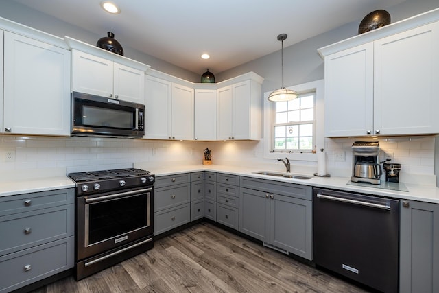 4785 Lauren Ln, Saint Joseph, MI 49085 - kitchen with stainless steel gas range oven, dishwasher, gray cabinets, and recessed lighting