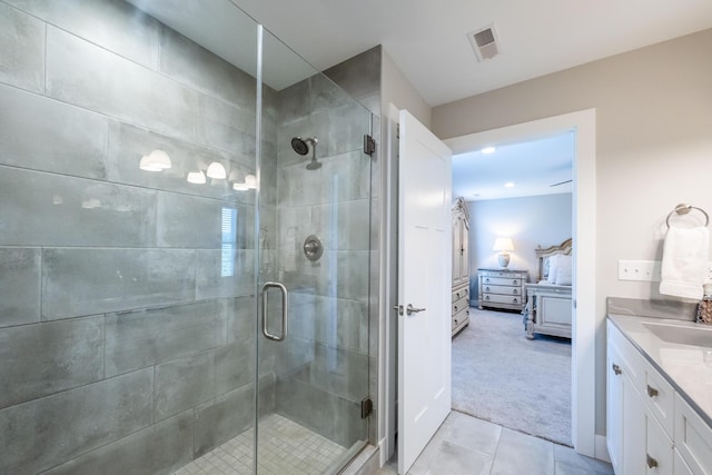 4785 Lauren Ln, Saint Joseph, MI 49085 - full bathroom featuring connected bathroom, vanity, tile patterned flooring, and a shower stall