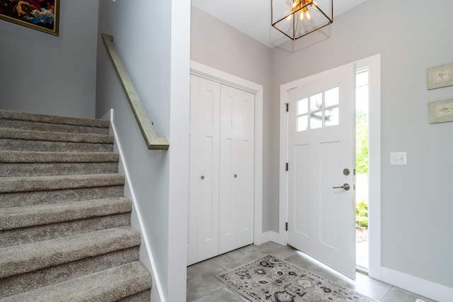 4785 Lauren Ln, Saint Joseph, MI 49085 - entryway featuring a chandelier and stairway