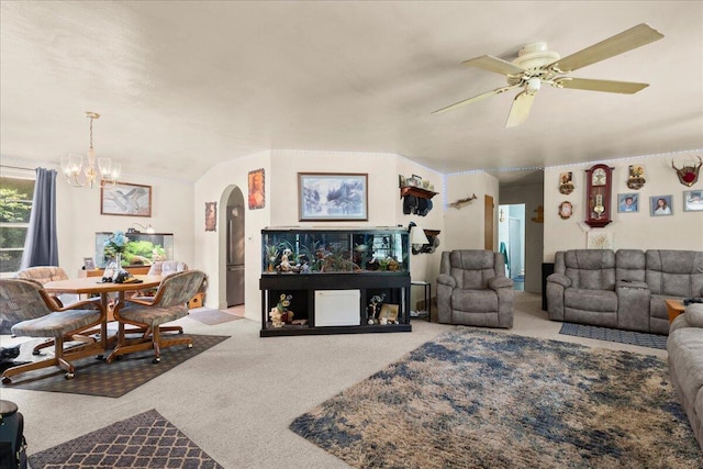 3658 Lake Harbor Rd, Norton Shores, MI 49441 - carpeted living room with arched walkways, a chandelier, and a ceiling fan