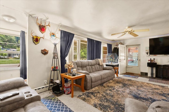 3658 Lake Harbor Rd, Norton Shores, MI 49441 - living room featuring a baseboard heating unit and a ceiling fan