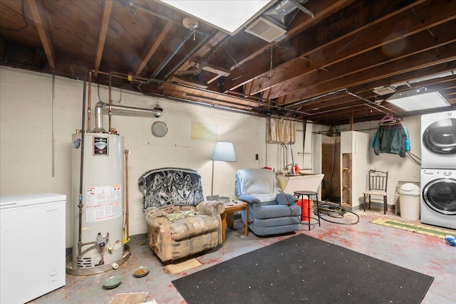 3658 Lake Harbor Rd, Norton Shores, MI 49441 - unfinished basement with water heater, fridge, and stacked washing machine and dryer