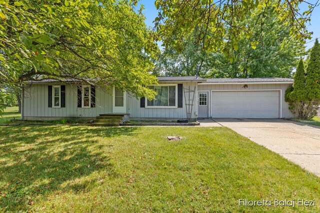 5640 Kraft Ave SE, Grand Rapids, MI 49512 - single story home with board and batten siding, a garage, concrete driveway, and a front lawn