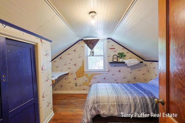 2025 Whitehall Rd, Muskegon, MI 49445 - bedroom featuring wood finished floors, wallpapered walls, lofted ceiling, and wood ceiling
