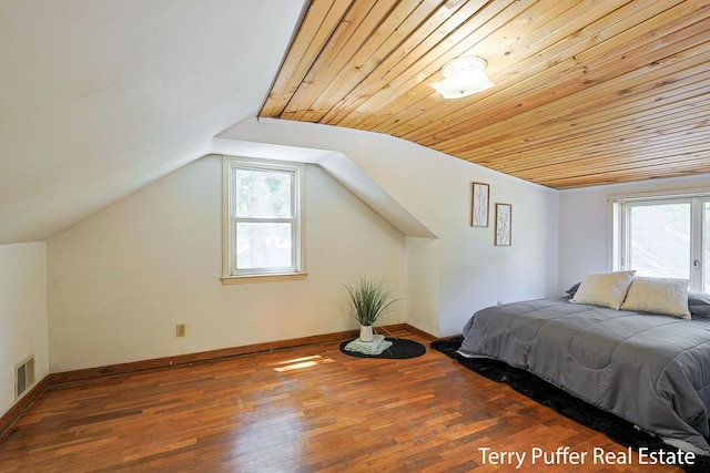 2025 Whitehall Rd, Muskegon, MI 49445 - bedroom featuring wood finished floors and vaulted ceiling