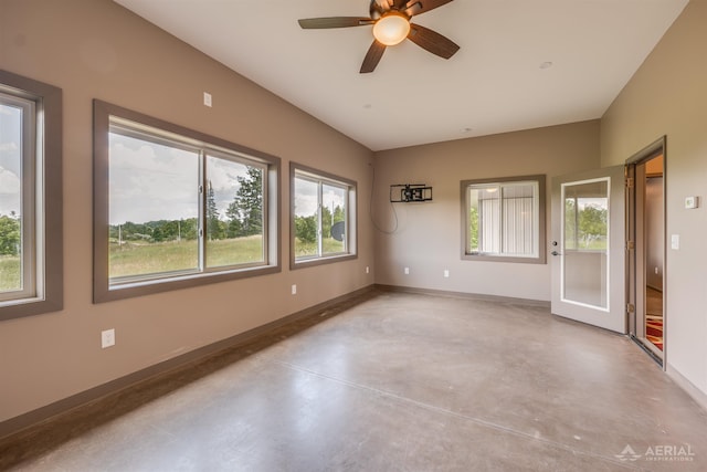 4646 Lehman Rd, West Branch, MI 48661 - spare room with concrete flooring and ceiling fan