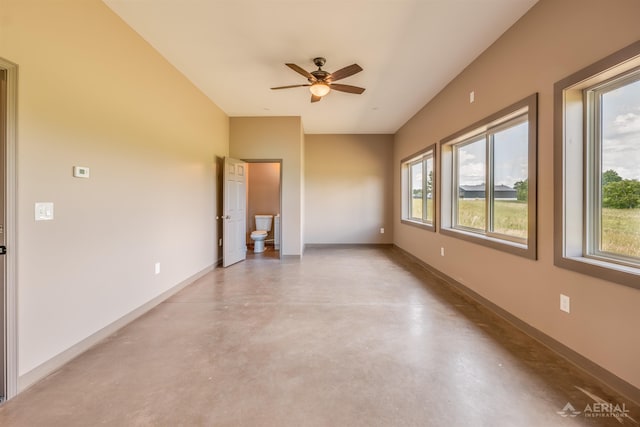 4646 Lehman Rd, West Branch, MI 48661 - spare room with concrete flooring and a ceiling fan