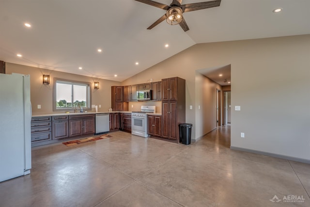 4646 Lehman Rd, West Branch, MI 48661 - kitchen featuring appliances with stainless steel finishes, finished concrete flooring, light countertops, recessed lighting, and vaulted ceiling