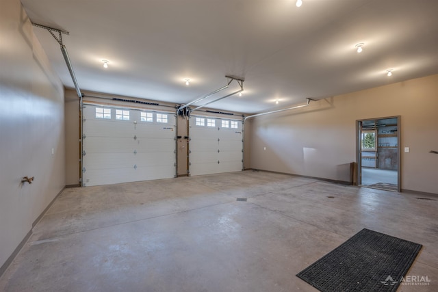 4646 Lehman Rd, West Branch, MI 48661 - garage featuring baseboards