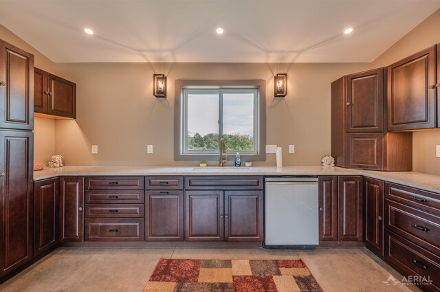 4646 Lehman Rd, West Branch, MI 48661 - kitchen with stainless steel dishwasher, dark brown cabinetry, and recessed lighting