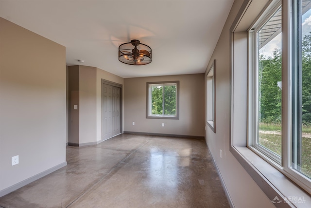 4646 Lehman Rd, West Branch, MI 48661 - empty room with baseboards and concrete floors