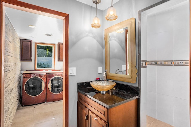 929 N Park Rd, Benton Harbor, MI 49022 - bathroom featuring washer and dryer, vanity, and tile patterned flooring