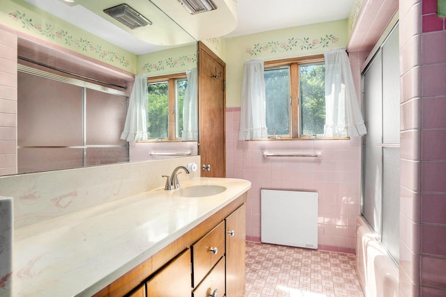929 N Park Rd, Benton Harbor, MI 49022 - bathroom with plenty of natural light, vanity, shower / tub combination, and tile walls