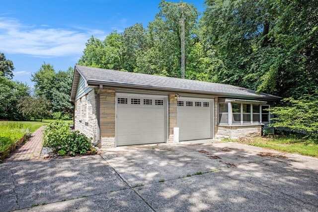 929 N Park Rd, Benton Harbor, MI 49022 - garage featuring concrete driveway