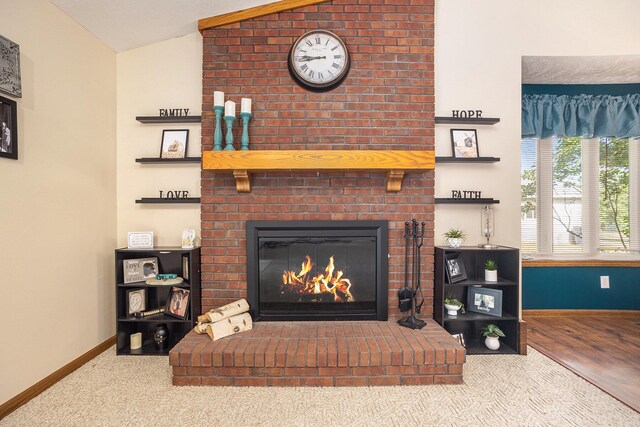 1972 Red Pine Dr, Dorr, MI 49323 - living area featuring lofted ceiling and a brick fireplace
