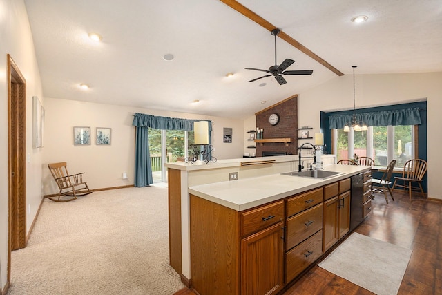 1972 Red Pine Dr, Dorr, MI 49323 - kitchen featuring ceiling fan, a brick fireplace, brown cabinets, dishwasher, and plenty of natural light
