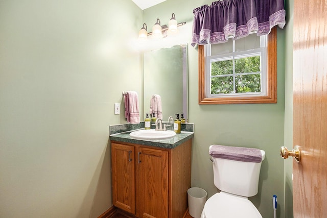 1972 Red Pine Dr, Dorr, MI 49323 - bathroom featuring vanity and toilet