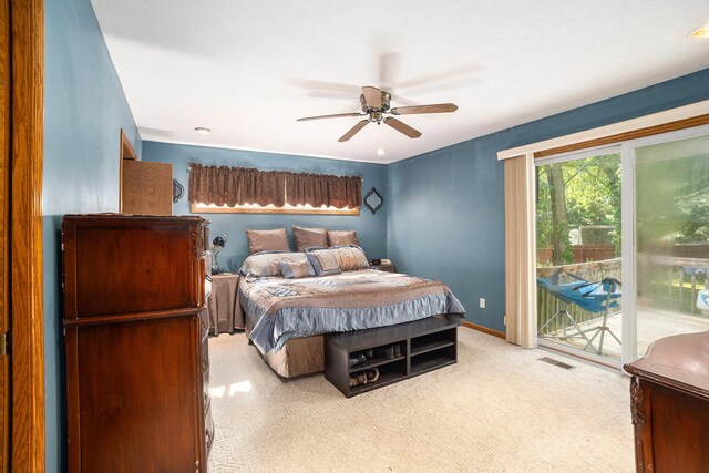 1972 Red Pine Dr, Dorr, MI 49323 - bedroom featuring access to exterior, carpet floors, and ceiling fan