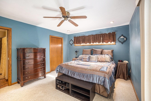 1972 Red Pine Dr, Dorr, MI 49323 - bedroom with light carpet, ceiling fan, and a closet