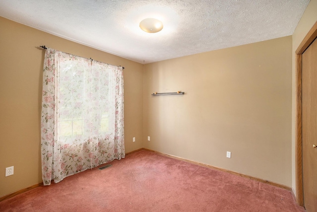 1972 Red Pine Dr, Dorr, MI 49323 - empty room featuring light carpet and a textured ceiling