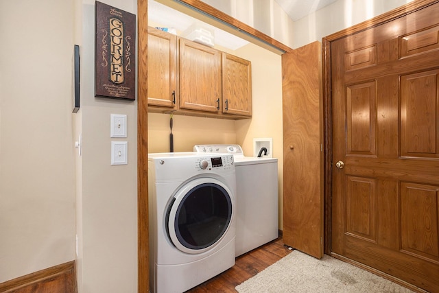 1972 Red Pine Dr, Dorr, MI 49323 - washroom with cabinet space, washing machine and dryer, and wood finished floors
