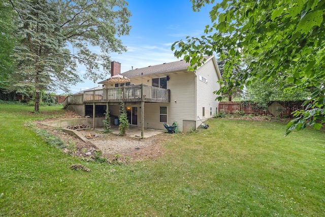 1972 Red Pine Dr, Dorr, MI 49323 - back of property with a wooden deck and a patio