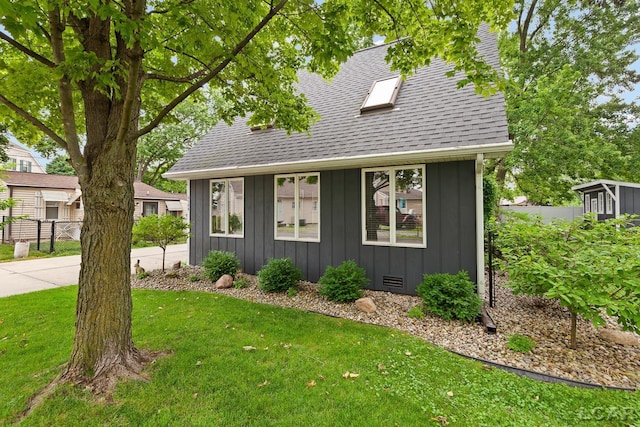 3129 Oakshade Dr, Manitou Beach, MI 49253 - view of front facade featuring board and batten siding and roof with shingles