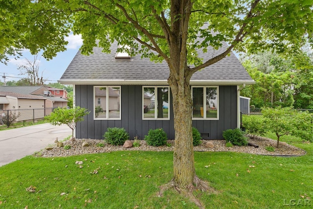 3129 Oakshade Dr, Manitou Beach, MI 49253 - view of front of home with board and batten siding and a shingled roof