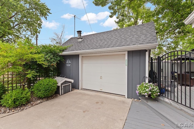 3129 Oakshade Dr, Manitou Beach, MI 49253 - detached garage with concrete driveway and a gate