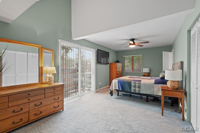 3129 Oakshade Dr, Manitou Beach, MI 49253 - carpeted bedroom featuring access to exterior, ceiling fan, and vaulted ceiling