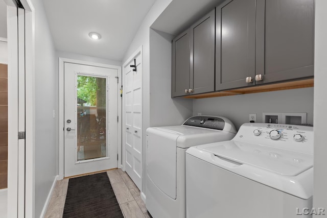 3129 Oakshade Dr, Manitou Beach, MI 49253 - laundry area featuring cabinet space and separate washer and dryer