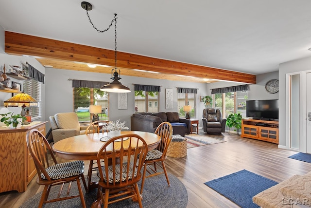 3129 Oakshade Dr, Manitou Beach, MI 49253 - dining room featuring beam ceiling, plenty of natural light, and wood finished floors