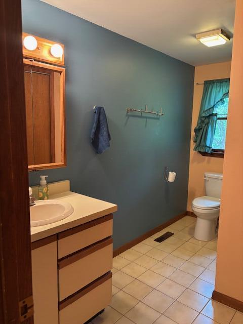 43618 Carla Dr, Paw Paw, MI 49079 - half bathroom with vanity and tile patterned flooring