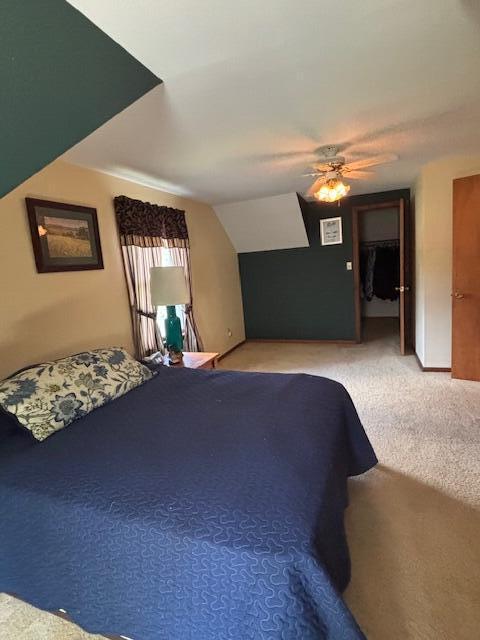 43618 Carla Dr, Paw Paw, MI 49079 - carpeted bedroom featuring ceiling fan and vaulted ceiling