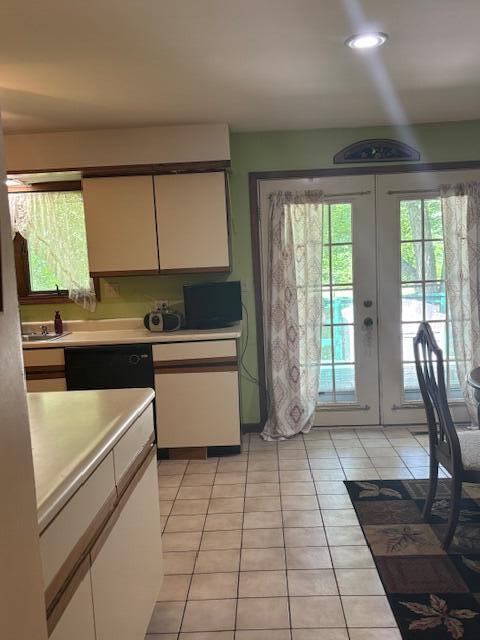 43618 Carla Dr, Paw Paw, MI 49079 - kitchen with light countertops, white cabinets, light tile patterned floors, french doors, and recessed lighting