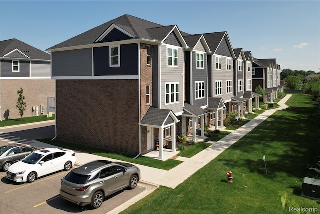 5973 Stella, Troy, MI 48085 - view of building exterior with a residential view and uncovered parking