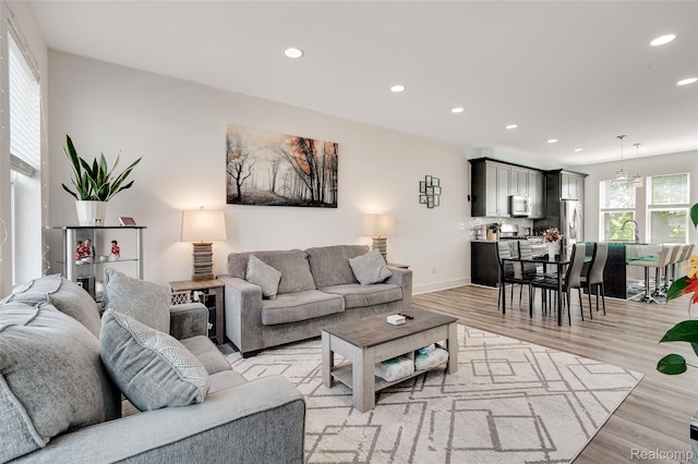 5973 Stella, Troy, MI 48085 - living room with recessed lighting and light wood-style flooring