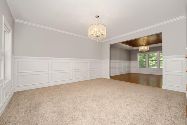 7226 Breton Woods Ct, Kalamazoo, MI 49009 - empty room featuring a chandelier, carpet, a decorative wall, crown molding, and a wainscoted wall